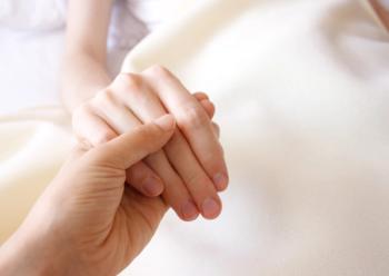 Pharmacist holding a patient's hand