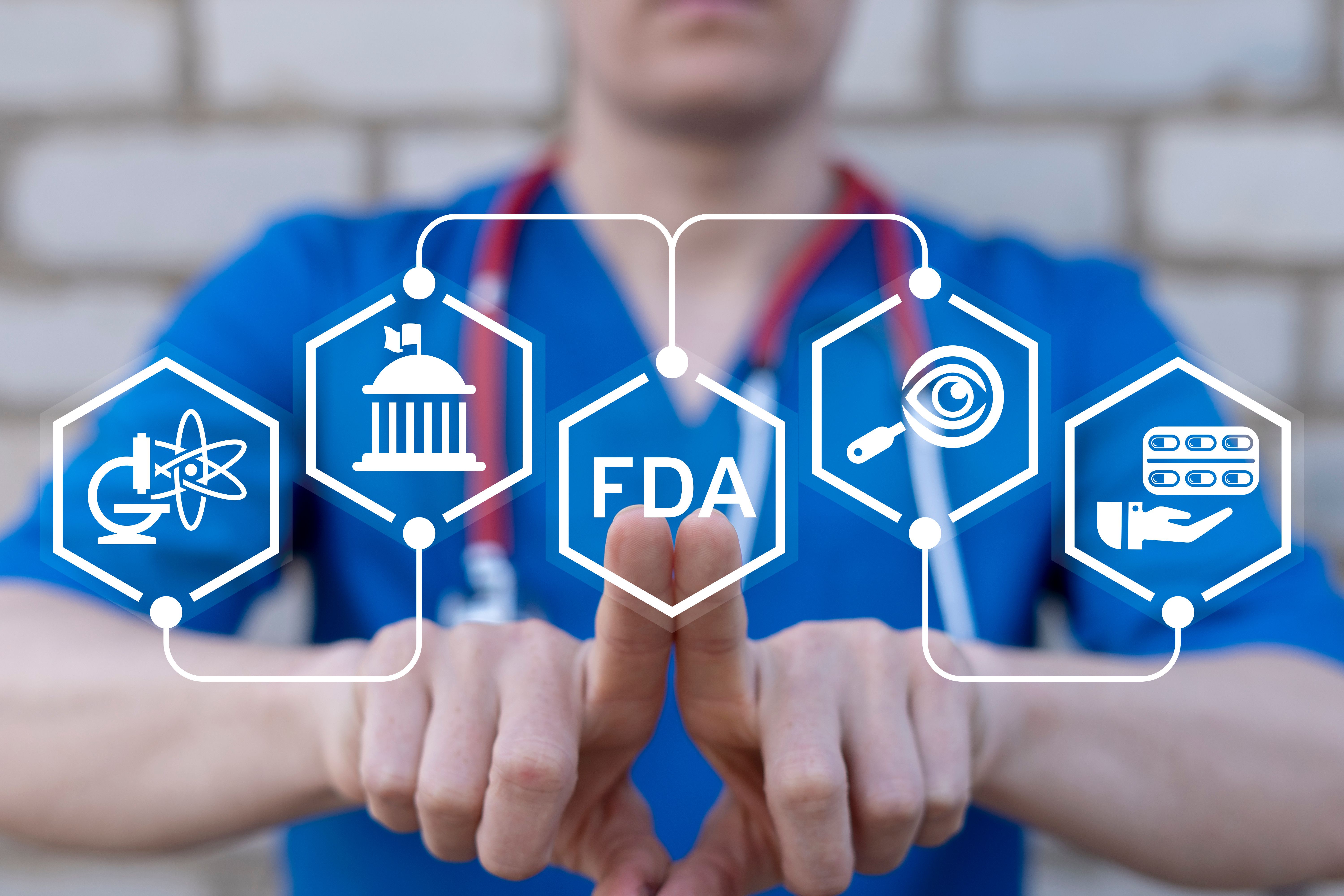 Doctor working on virtual touch screen presses abbreviation: FDA. Food and Drug Administration ( FDA ) Department Service Medical Concept. | Image Credit: wladimir1884 | stock.adobe.com