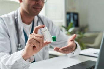 Doctor holding inhaler | Image Credit: © pressmaster - stock.adobe.com
