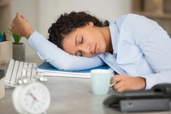 Woman asleep at desk | auremar | stock.adobe.com