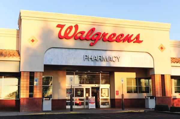 A Walgreens storefront with a visible pharmacy sign illustrates retail pharmaceutical infrastructure, healthcare access, and the commercial footprint of national drugstore chains in suburban areas
