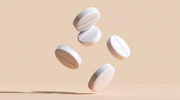 Five white round tablets arranged in floating pattern against soft beige background with subtle shadows under studio lighting | Image Credit: Windy Junes | stock.adobe.com