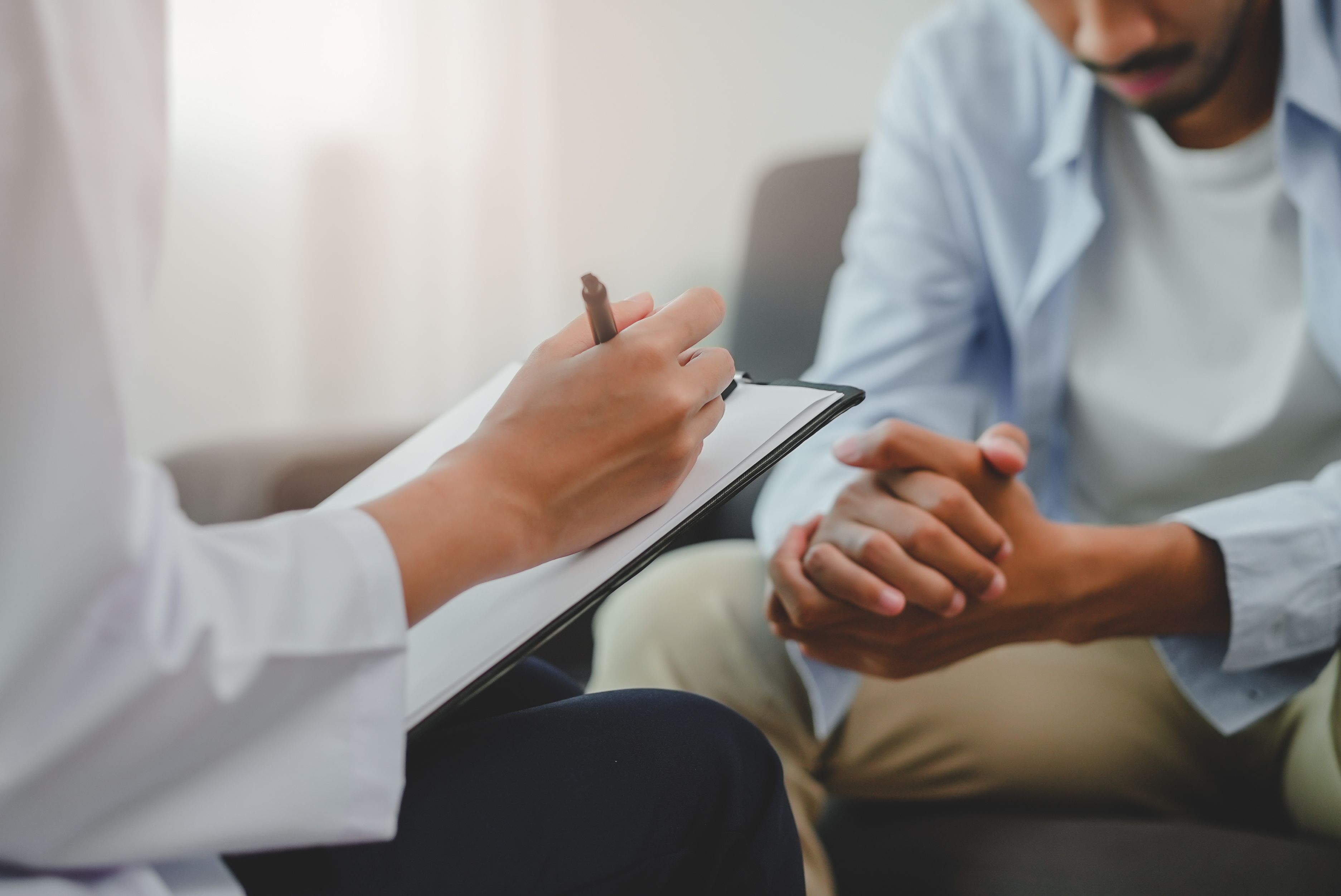 Patient consulting with health care provider -- Image credit: Pormezz | stock.adobe.com