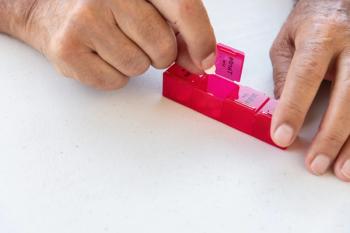 Close-up of an elderly hand taking a pill from a weekly pill organizer. Concept of medication adherence, daily treatment and home healthcare - Image credit: Sergio | stock.adobe.com