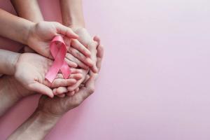 hands holding pink ribbons, Breast cancer awareness and October Pink day, world cancer day | Image Credit: Sewcream Studio | adobe.stock.com