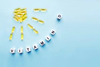 Yellow capsules in the form of the sun with rays and the word vitamin D from white cubes with letters on a blue background. VITAMIN D word for healthy | Image Credit: © irissca - stock.adobe.com