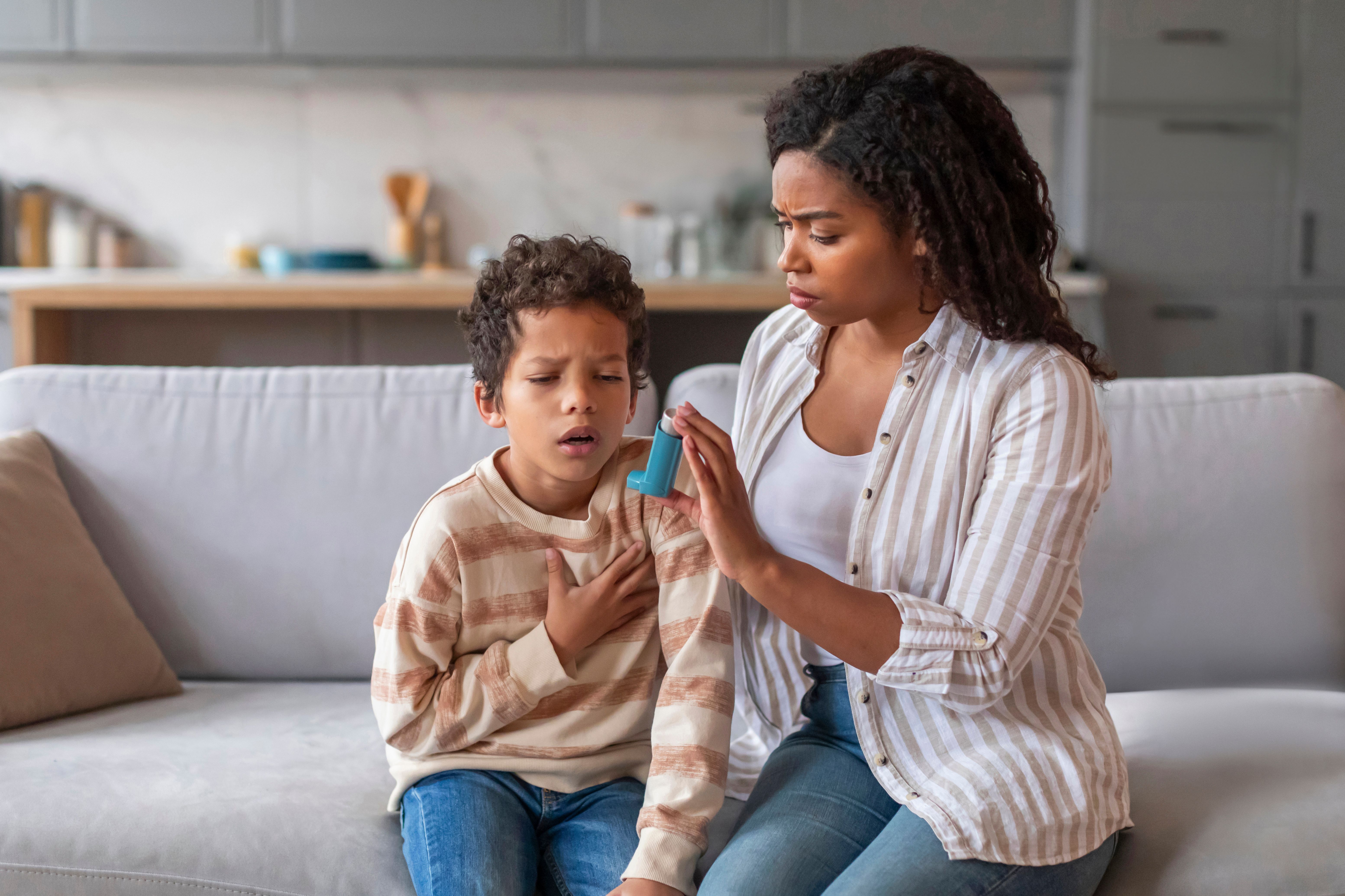 Child with asthma needing inhaler -- Image credit: Prostock-studio | stock.adobe.com
