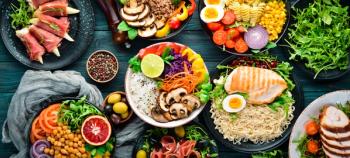 Assortment of healthy food dishes. Top view. | Image Credit: Yaruniv-Studio - stock.adobe.com