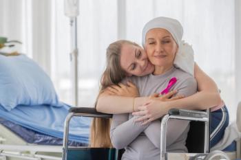 A woman affected by chemotherapy holds the hand of her daughter with hope and trust in love. | Image Credit: Bangkok Click Studio | stock.adobe.com