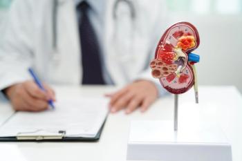 Health care professional and model of a kidney -- Image credit: manassanant | stock.adobe.com