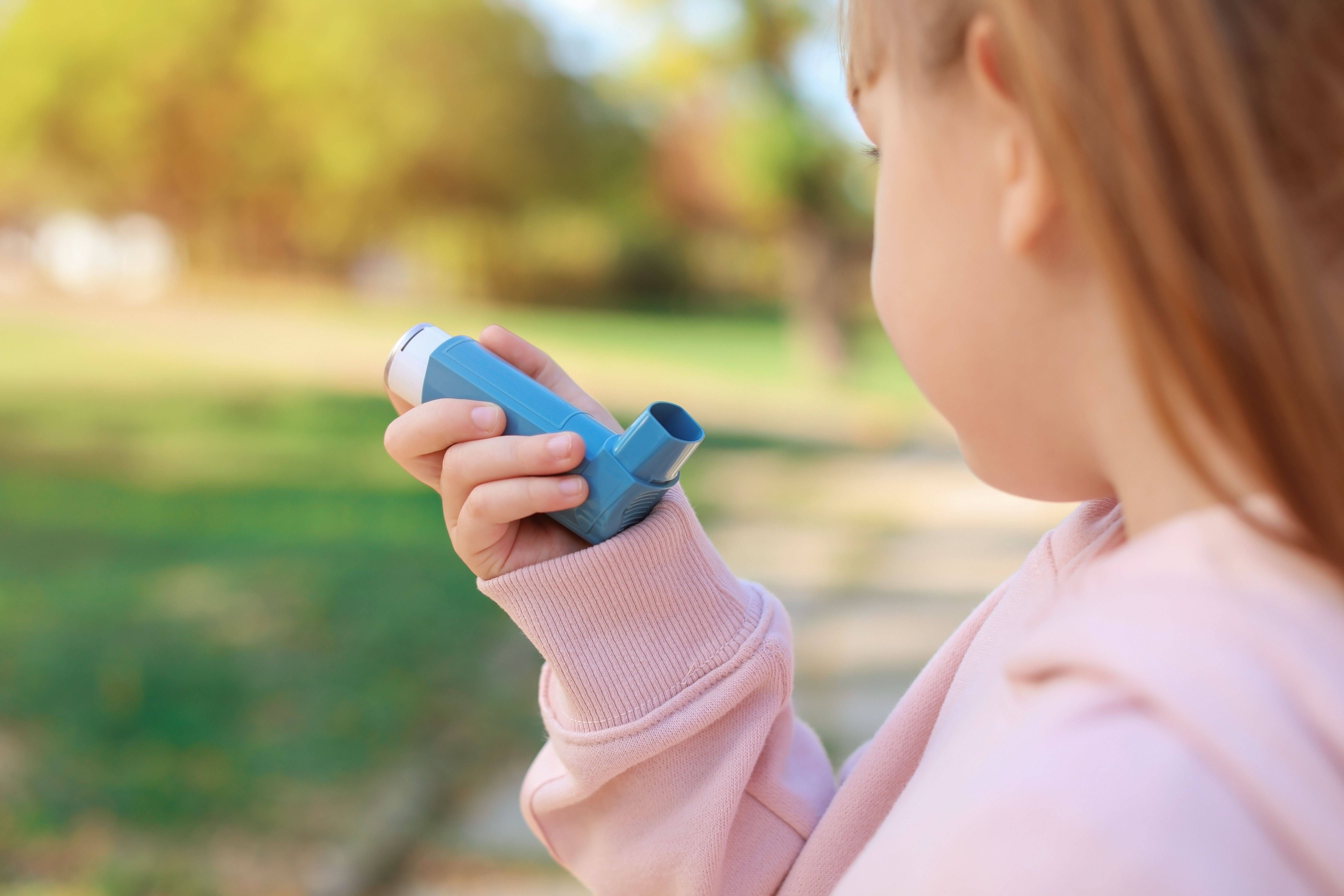 Young girl with asthma using inhaler -- Image credit: New Africa | stock.adobe.com