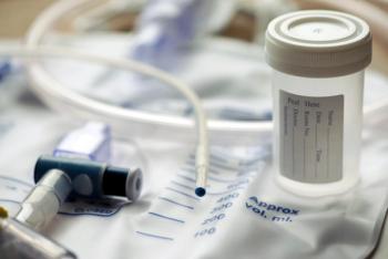 Urinary Catheter And Sample Cup - Image credit: Sherry Young | stock.adobe.com