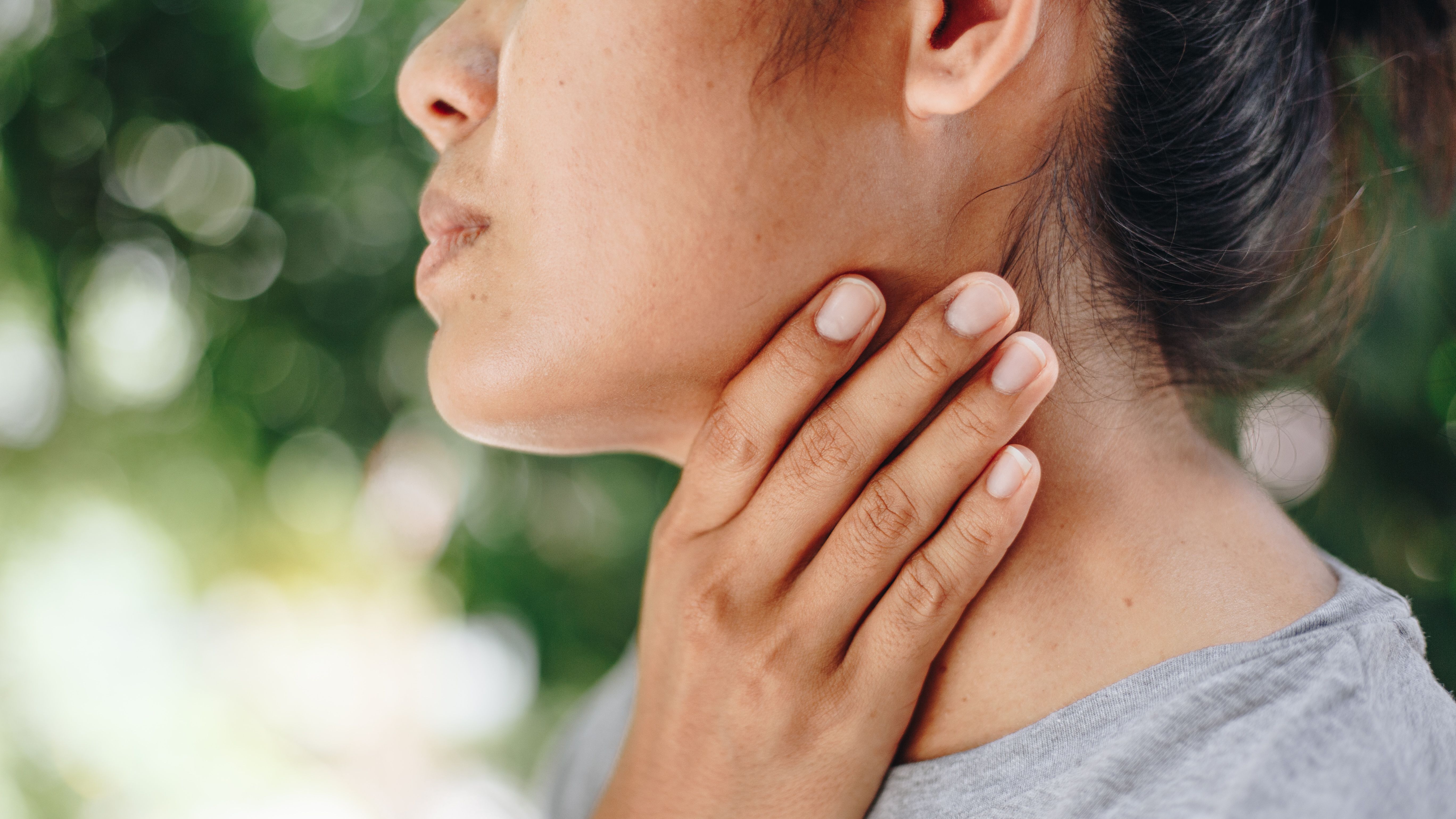 Sick Young Woman Feeling Bad Suffering From Throat Pain, Sore Throat ,Painful Swallowing , Health Concept. - Image credit: anut21ng Stock | stock.adobe.com