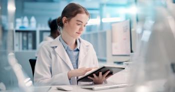 Pharmacy student using AI on tablet -- Image credit: peopleimages.com | stock.adobe.com