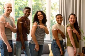 Group of happy friends showing plasters after vaccination | Image Credit: wavebreak3 | stock.adobe.com