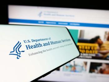Mobile phone with logo of American Department of Health and Human Services | Image Credit: © Timon - stock.adobe.com 