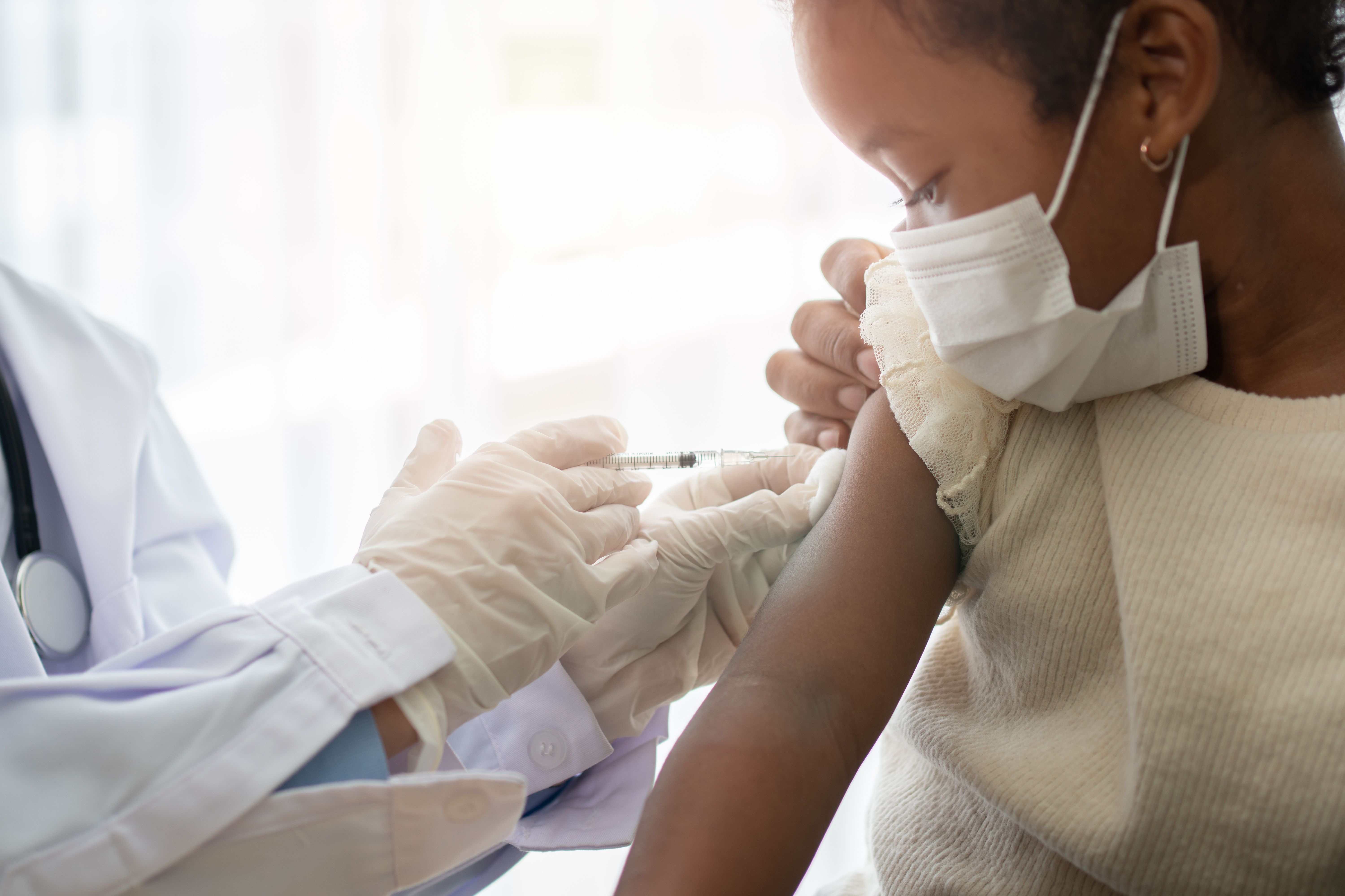Young girl receiving COVID-19 vaccine -- Image credit: Prot | stock.adobe.com
