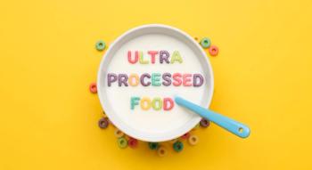 A bowl of cereal with the words "ULTRA PROCESSED FOOD" written on it, surrounded by cereal pieces. | Image Credit: Mono | stock.adobe.com 