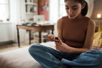 Teenage girl applicating insulin with insulin pen - Image credit: Halfpoint | stock.adobe.com