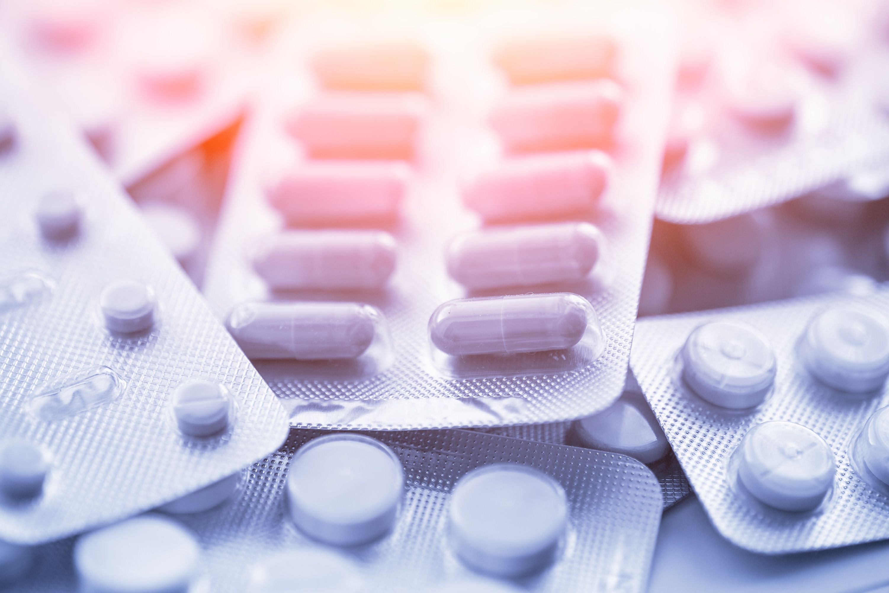 Different medicines: tablets, pills in blister pack, medications drugs, macro, selective focus, copy space, blue toned - Image credit: DedMityay | stock.adobe.com