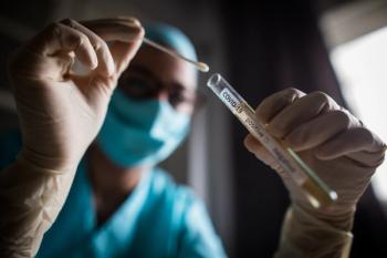 Doctor holding a coronavirus COVID-19 test tube - Image credit: bizoo_n | stock.adobe.com 