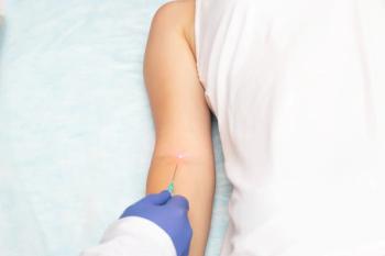 The doctor makes the intravenous laser blood purification of the patient's concept of rejuvenation and getting rid of chronic diseases, blood irradiation therapy