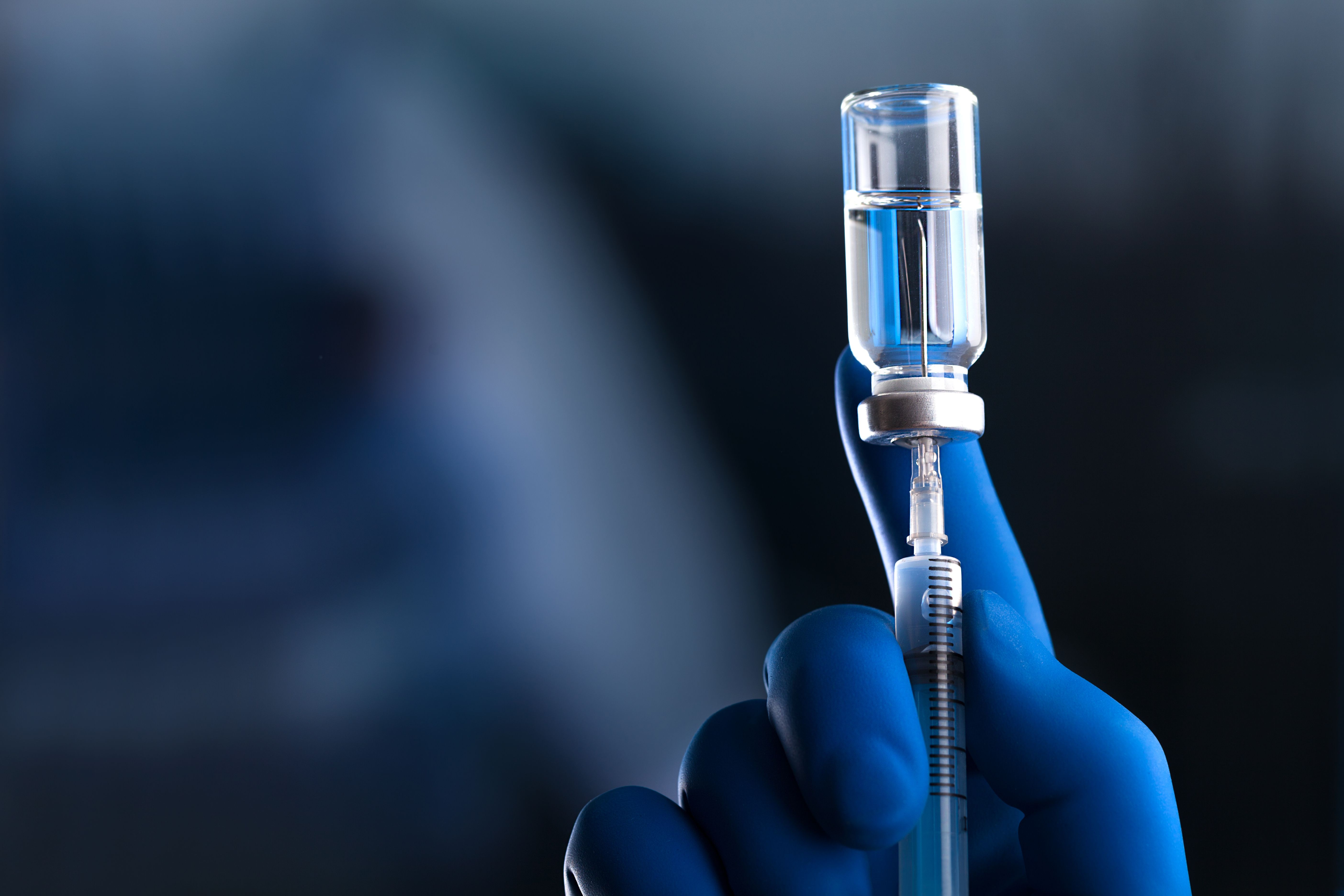 Physician preparing a vaccine