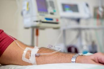 Patient receiving cancer treatment infusion -- Image credit: UlrikaArt | stock.adobe.com