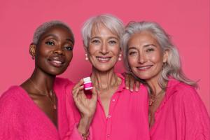 Postmenopausal women holding flibanserin bottle | Image Credit: © Sprout Pharmaceuticals
