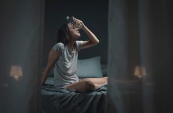 Woman in bedroom suffering during a heatwave Image credit: Stokkete | stock.adobe.com