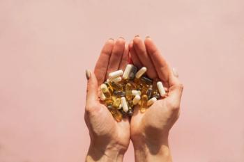 Hands holding supplements | Image credit: Diana Vyshniakova - stock.adobe.com