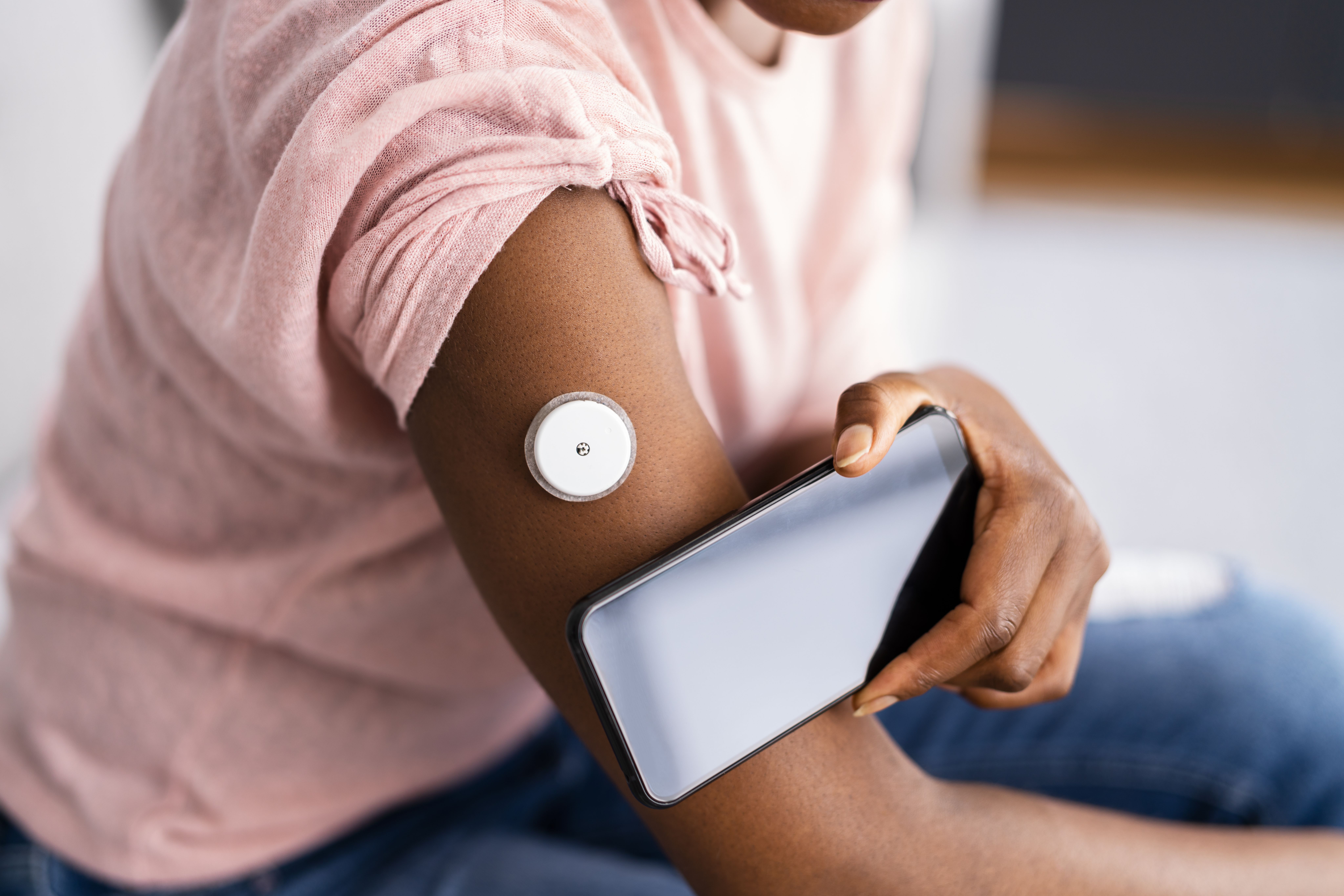 Woman Testing Glucose Level With Continuous Glucose Monitor | Image Credit: Andrey Popov | stock.adobe.com