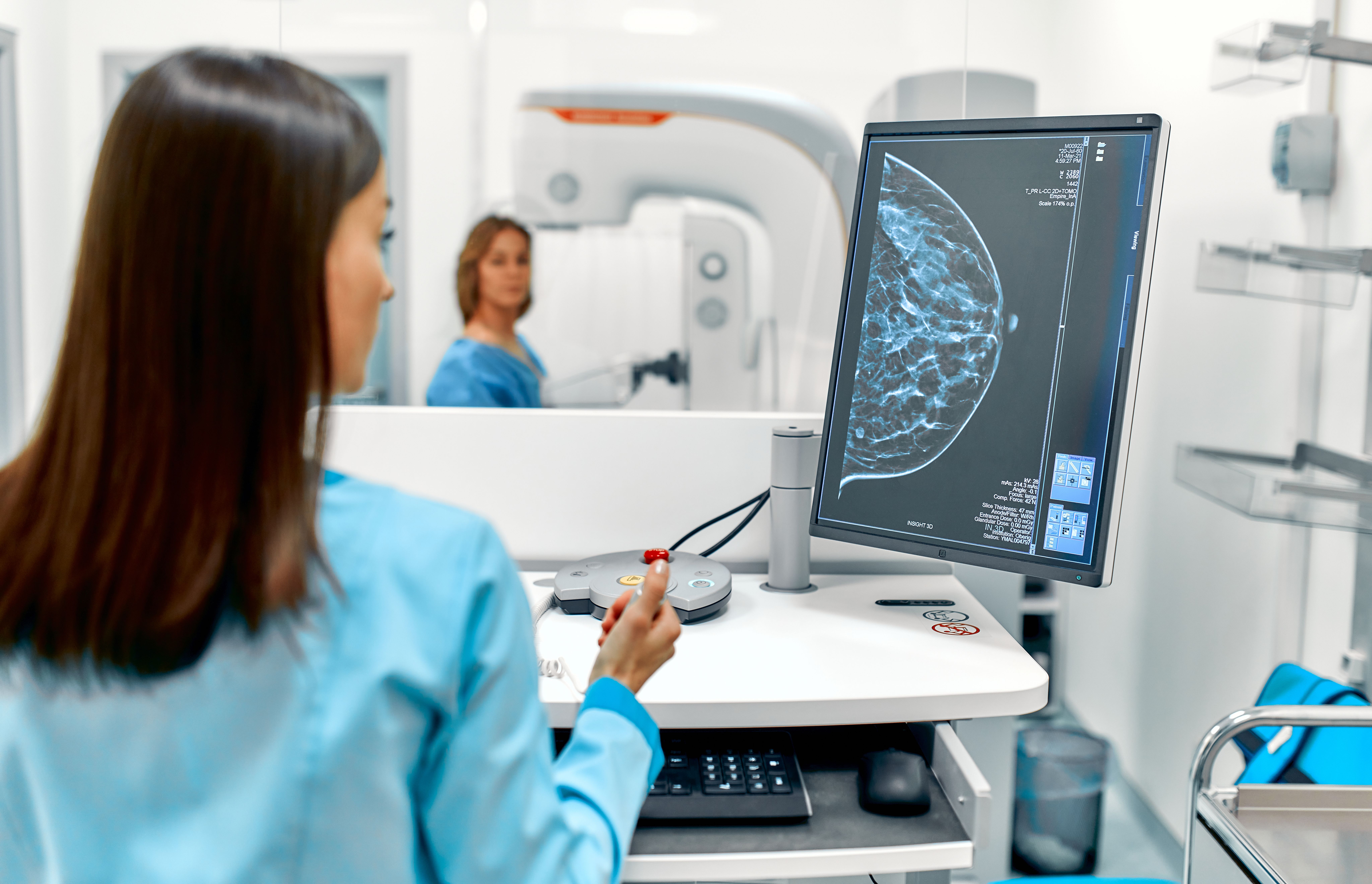 In the hospital, the patient undergoes a screening procedure for a mammogram, which is performed by a mammogram. A modern technologically advanced clinic with professional doctors. Image Credit: Valerii Apetroaiei | stock.adobe.com