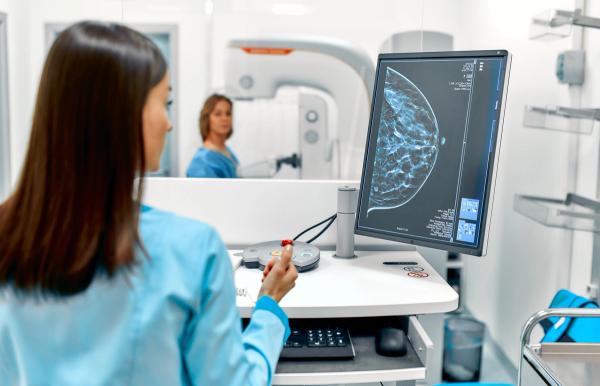In the hospital, the patient undergoes a screening procedure for a mammogram, which is performed by a mammogram. A modern technologically advanced clinic with professional doctors. | Image Credit: Valerii Apetroaiei | stock.adobe.com