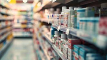 Shelf in a pharmacy stocked with various medication boxes, with a focus on the packaging in the foreground and a blurred background - Image credit: Studio Nova | stock.adobe.com