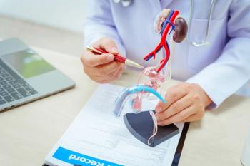 Doctor holding bladder model | Image Credit: © M+Isolation+Photo - stock.adobe.com