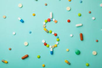 Symbol of money dollar from colored pills and capsules on green background. | Image Credit: adragan - stock.adobe.come