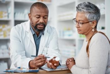 Pharmacist counseling a patient -- Image credit: Clayton D/peopleimages.com | stock.adobe.com