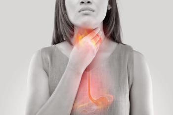 Woman suffering from heartburn or acid reflux.