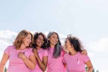 Cheerful women with ribbons of breast cancer awareness | Image Credit: LIGHTFIELD STUDIOS | stock.adobe.com
