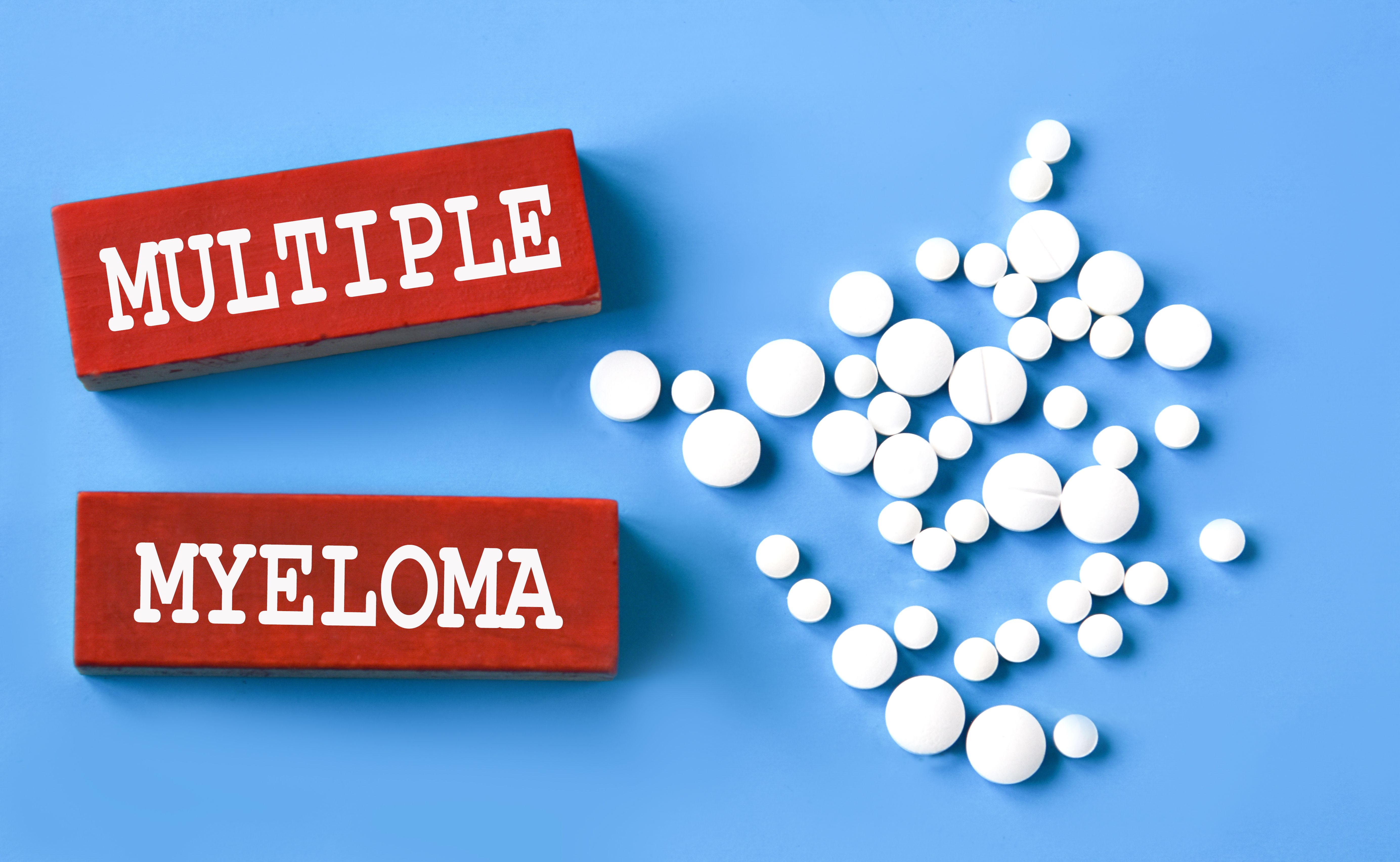 MULTIPLE MYELOMA - words on wooden red bars on a blue background with pills | Image Credit: Zhanna | stock.adobe.com