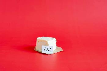 A piece of margarine in close-up on a red background and the inscription low-density lipoproteins ldl