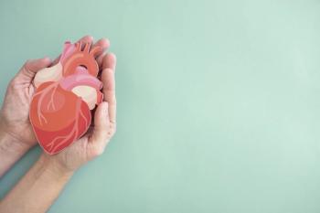 Person holding a paper cut-out of a heart Image credit: SewcreamStudio | stock.adobe.com