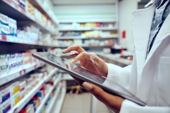 Closeup of hands of young female pharmacist checking inventory in medical store using digital tablet - Image credit: StratfordProductions | stock.adobe.com 