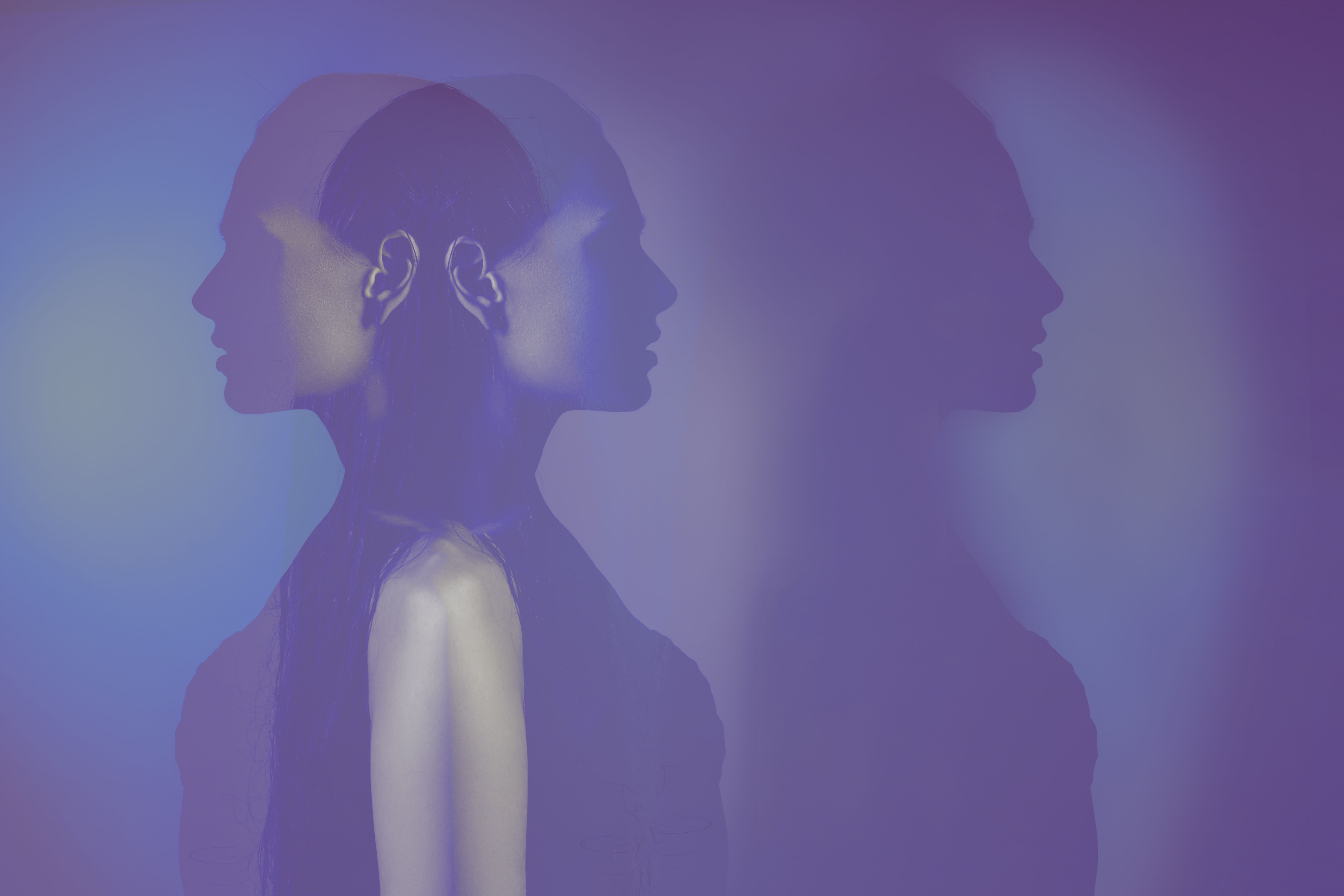 bipolar mental disorder. Double face. Split personality. Conceptual mood disorder. Dual personality concept. 2 silhouettes of a female head. mental health. Imaginatio - Image credit: Julia | stock.adobe.com