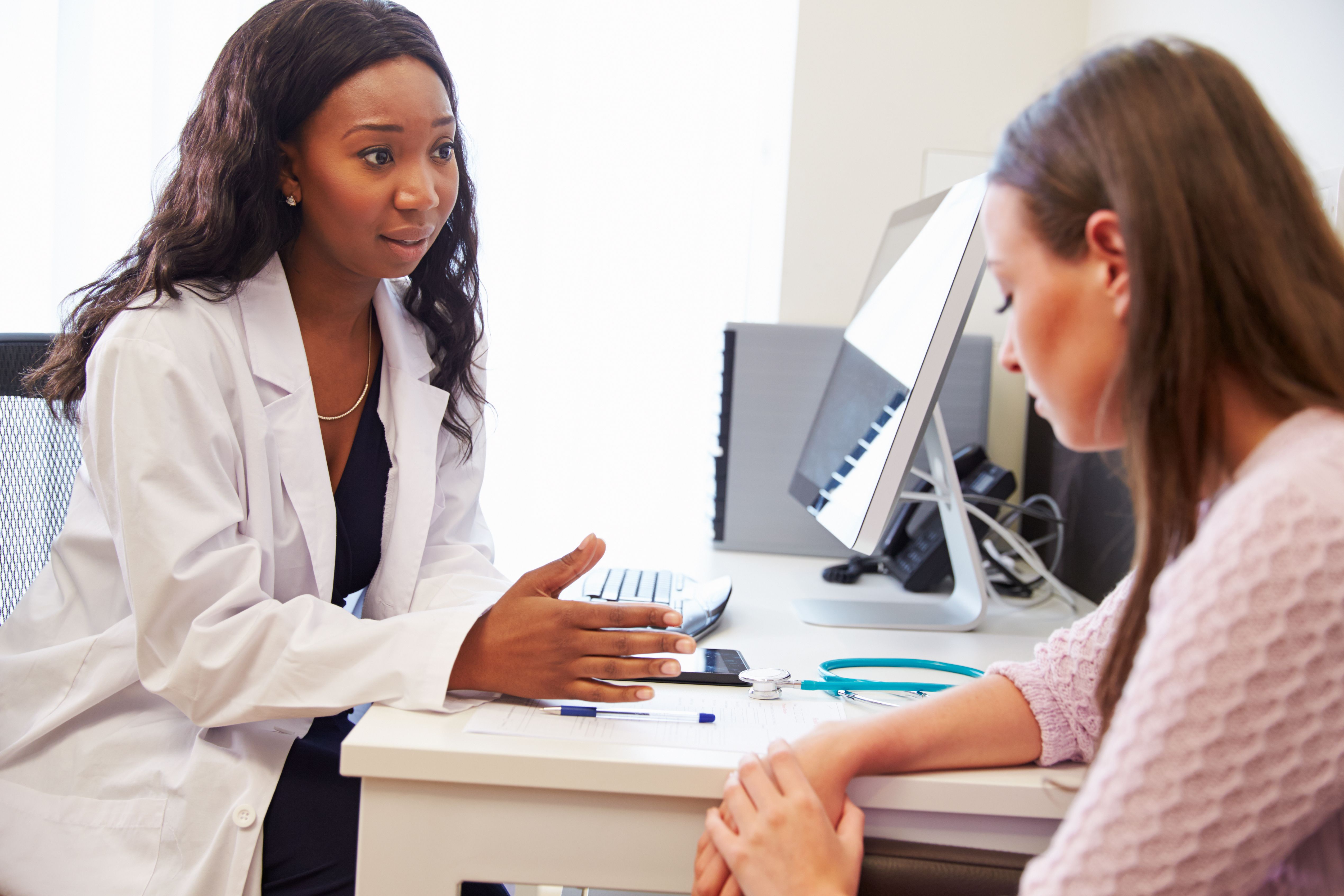 Health care professional discussing treatment options with patient