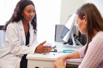 Health care professional discussing treatment options with patient