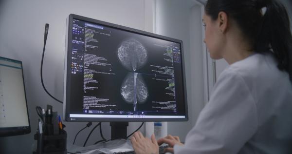 Professional female doctor examines results of mammography screening procedure using computer. | Image Credit: Framestock | stock.adobe.com