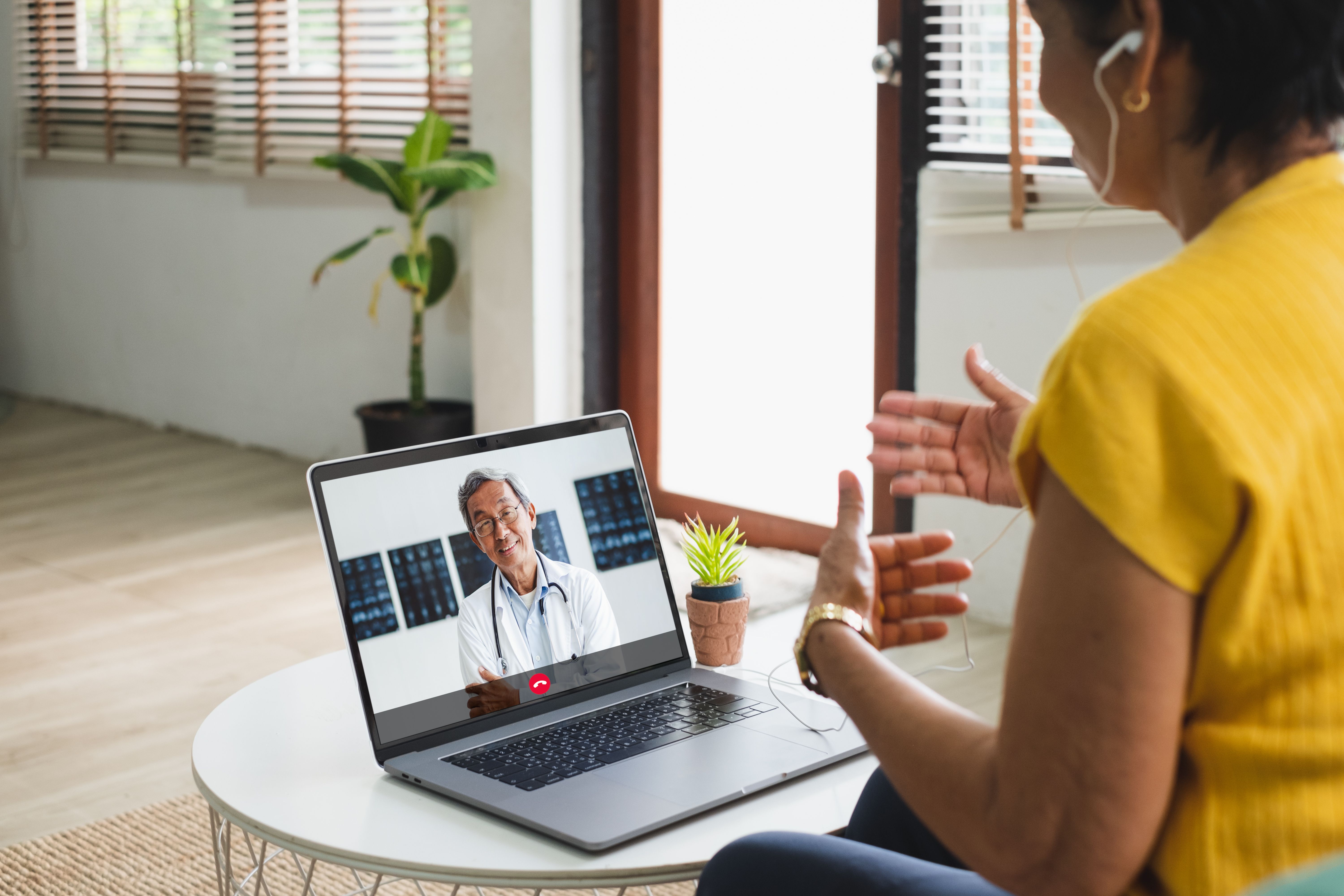 Patient speaking to health care professional during virtual appointment -- Image credit: Nattakorn | stock.adobe.com