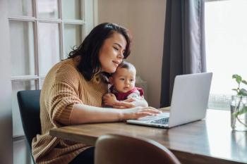 Pharmacy student and her infant -- Image credit: Inti St. Clair | stock.adobe.com